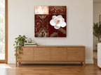 White Magnolia on Burgundy floral canvas print on the wall of a living room above a sideboard
