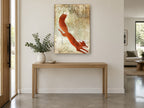 Leaping Winter Fox animal canvas print on the wall of a entry hall