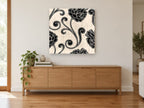 Black Peony Scrolls floral canvas print on the wall of a living room above a sideboard