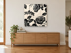 Black Damask Roses floral canvas print on the wall of a living room above a sideboard