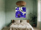 Indigo Delphinium Bloom floral canvas print on the wall of a bedroom