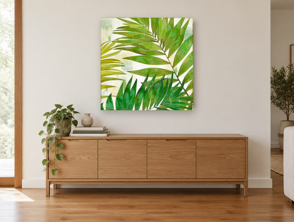 Green Palm Fronds floral canvas print on the wall of a living room above a sideboard