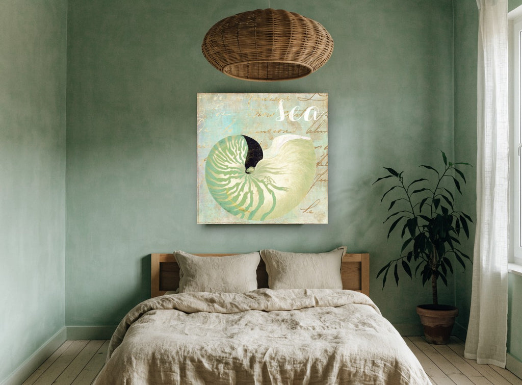 Green Nautilus Shell coastal canvas print on the wall of a bedroom