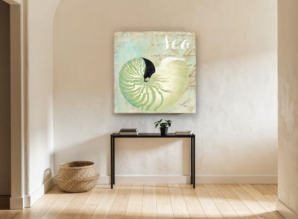 Green Nautilus Shell coastal canvas print on the wall of a hallway