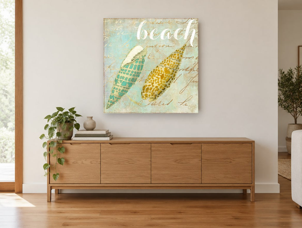 Twin Shells on Script coastal canvas print on the wall of a living room above a sideboard