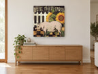 Farmyard Pig and Sunflowers floral canvas print on the wall of a living room above a sideboard