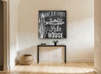 Chalkboard Lake House Welcome landscape canvas print on the wall of a hallway
