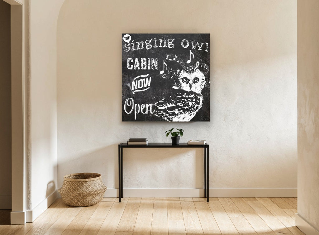 Singing Owl Cabin animal canvas print on the wall of a hallway