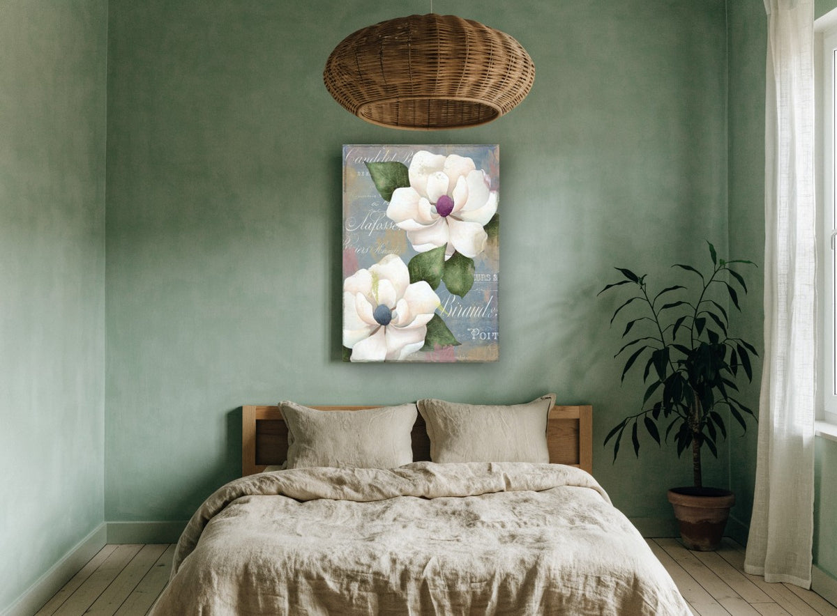 Magnolias on French Script floral canvas print on the wall of a bedroom