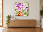 Garden Script Bloom floral canvas print on the wall of a living room above a sideboard