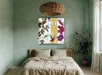 Cherries and Hummingbirds floral canvas print on the wall of a bedroom
