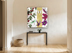 Cherries and Hummingbirds floral canvas print on the wall of a hallway