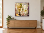 Chablis Grapes and Glass kitchen canvas print on the wall of a living room above a sideboard