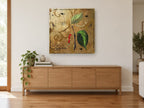 Pepper Vine Gold floral canvas print on the wall of a living room above a sideboard
