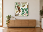 Frosted Pine and Holly floral canvas print on the wall of a living room above a sideboard