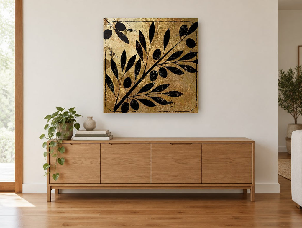 Olive Branch Gilt Silhouette floral canvas print on the wall of a living room above a sideboard