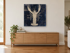 Lobster on Indigo Chart vintage canvas print on the wall of a living room above a sideboard