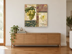 Green Grapes and White Wine kitchen canvas print on the wall of a living room above a sideboard