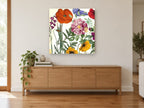 Spring Poppy Collage floral canvas print on the wall of a living room above a sideboard