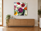 Poppy and Dahlia Garden floral canvas print on the wall of a living room above a sideboard