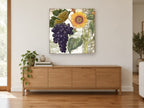 Sunflower and Grape Harvest floral canvas print on the wall of a living room above a sideboard