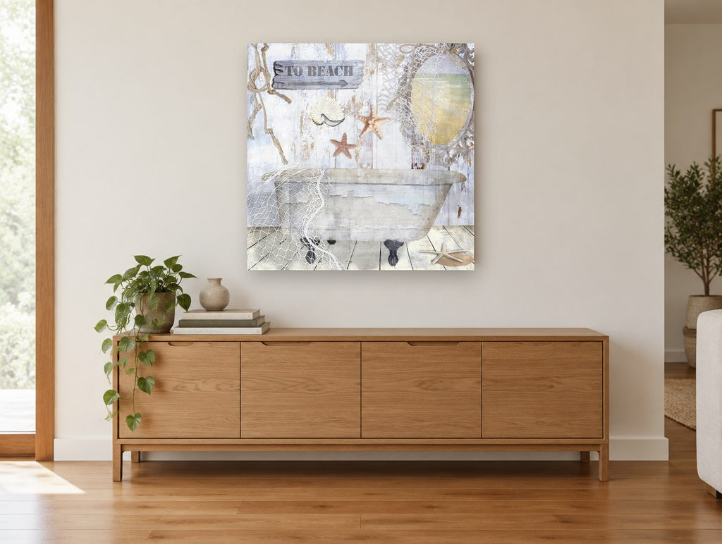 Seaside Bathtub Retreat coastal canvas print on the wall of a living room above a sideboard
