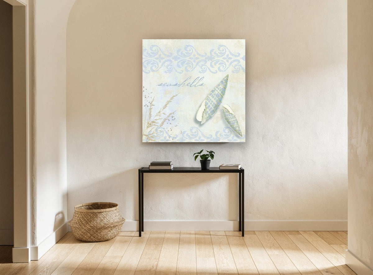 Pale Spindle Shells coastal canvas print on the wall of a hallway