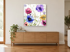 Meadow Anemone Garden floral canvas print on the wall of a living room above a sideboard
