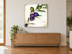 Purple Olive Sprig floral canvas print on the wall of a living room above a sideboard