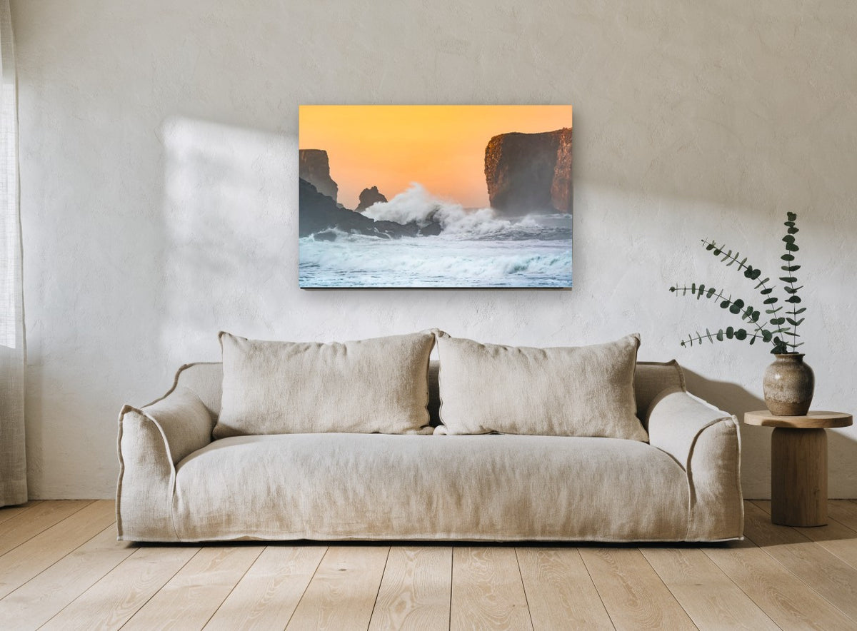 Sunset Spray Cliffs coastal canvas print on the wall of a living room