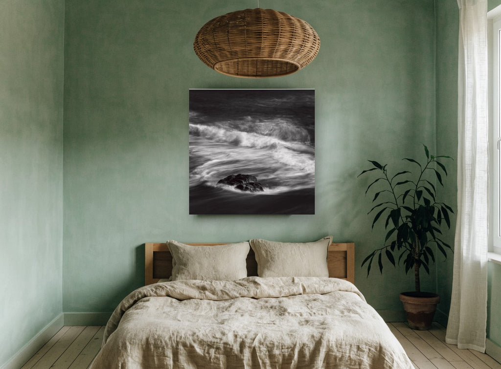 Rock in Swirling Surf coastal canvas print on the wall of a bedroom