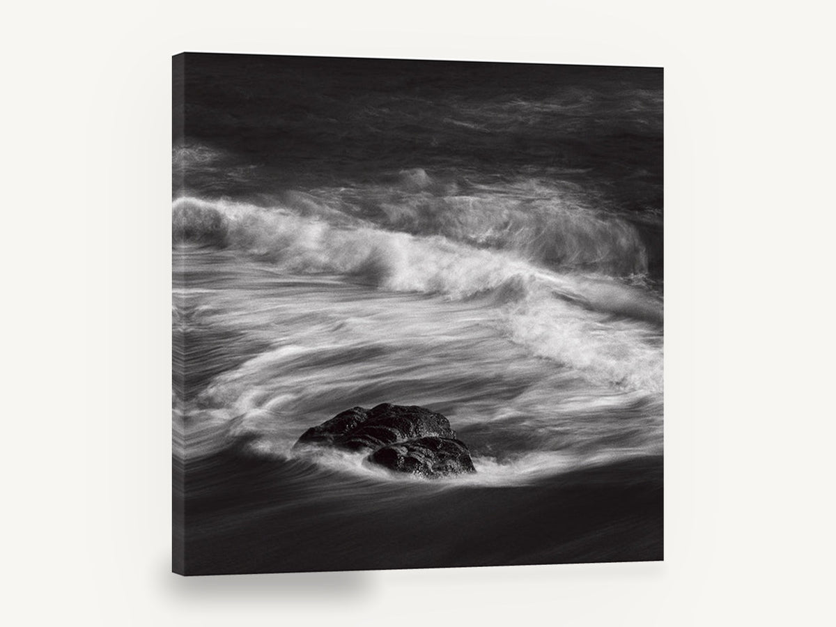 Rock in Swirling Surf, black and white wave rock photograph, coastal canvas wall art print ready to hang