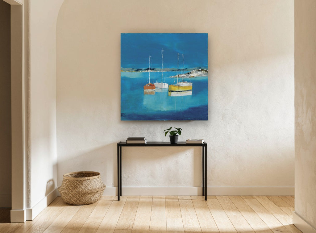 Three Boats at Rest coastal canvas print on the wall of a hallway