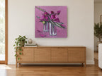 Magenta Blocks in Silver floral canvas print on the wall of a living room above a sideboard