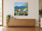 Poppies Above the Bay landscape canvas print on the wall of a living room above a sideboard