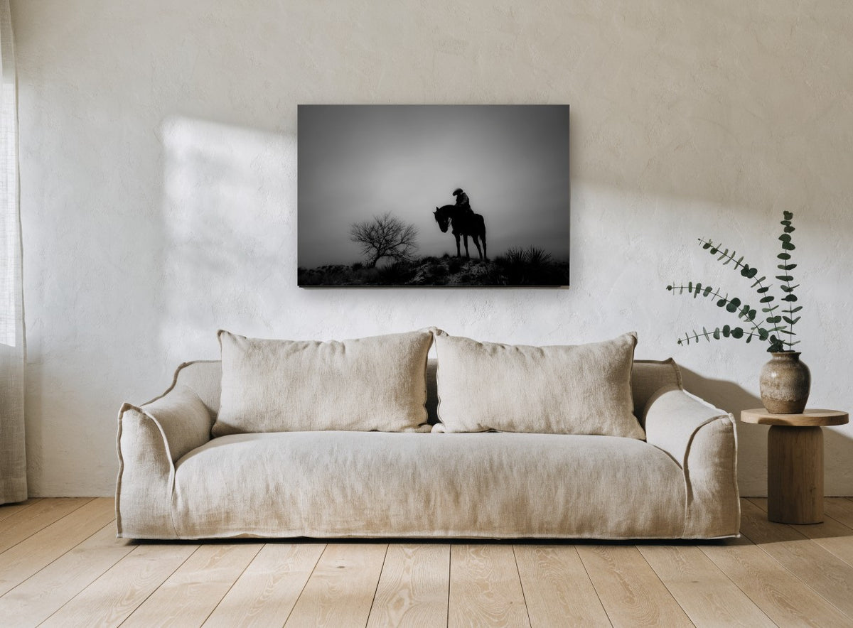 Lone Rider at Dusk landscape canvas print on the wall of a living room