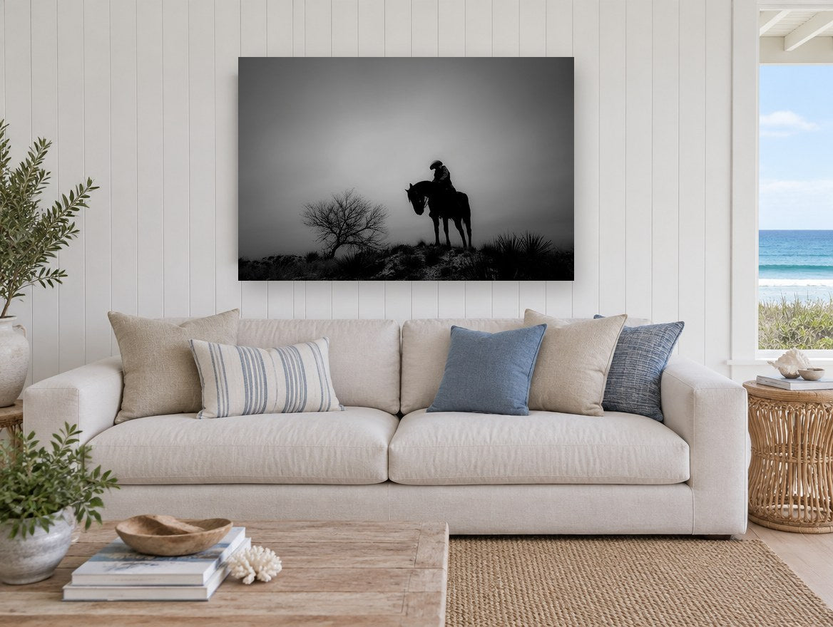 Lone Rider at Dusk landscape canvas print on the wall of a beach house living room