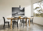 Galloping Through Shallows animal canvas print on the wall of a dining room