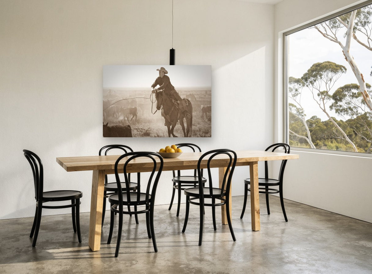 Dust and Cattle Rider animal canvas print on the wall of a dining room