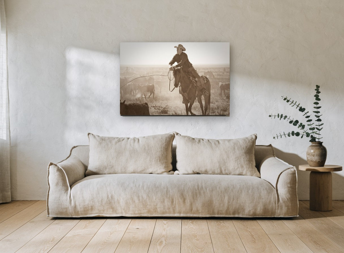 Dust and Cattle Rider animal canvas print on the wall of a living room