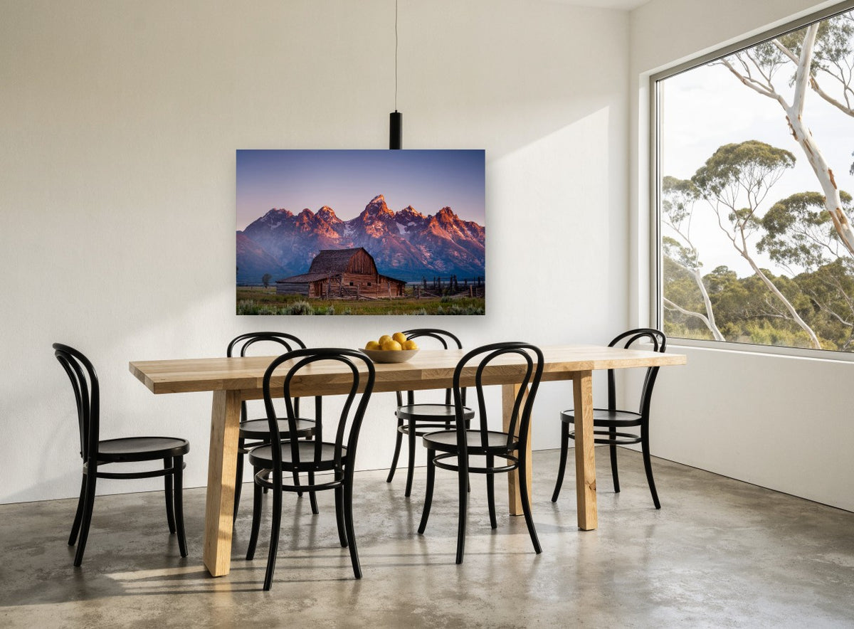 First Light Barn landscape canvas print on the wall of a dining room