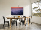 Layered Peaks at Dawn landscape canvas print on the wall of a dining room