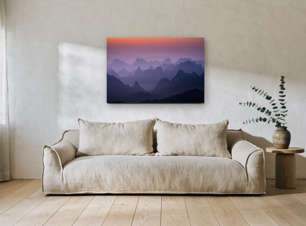 Layered Peaks at Dawn landscape canvas print on the wall of a living room