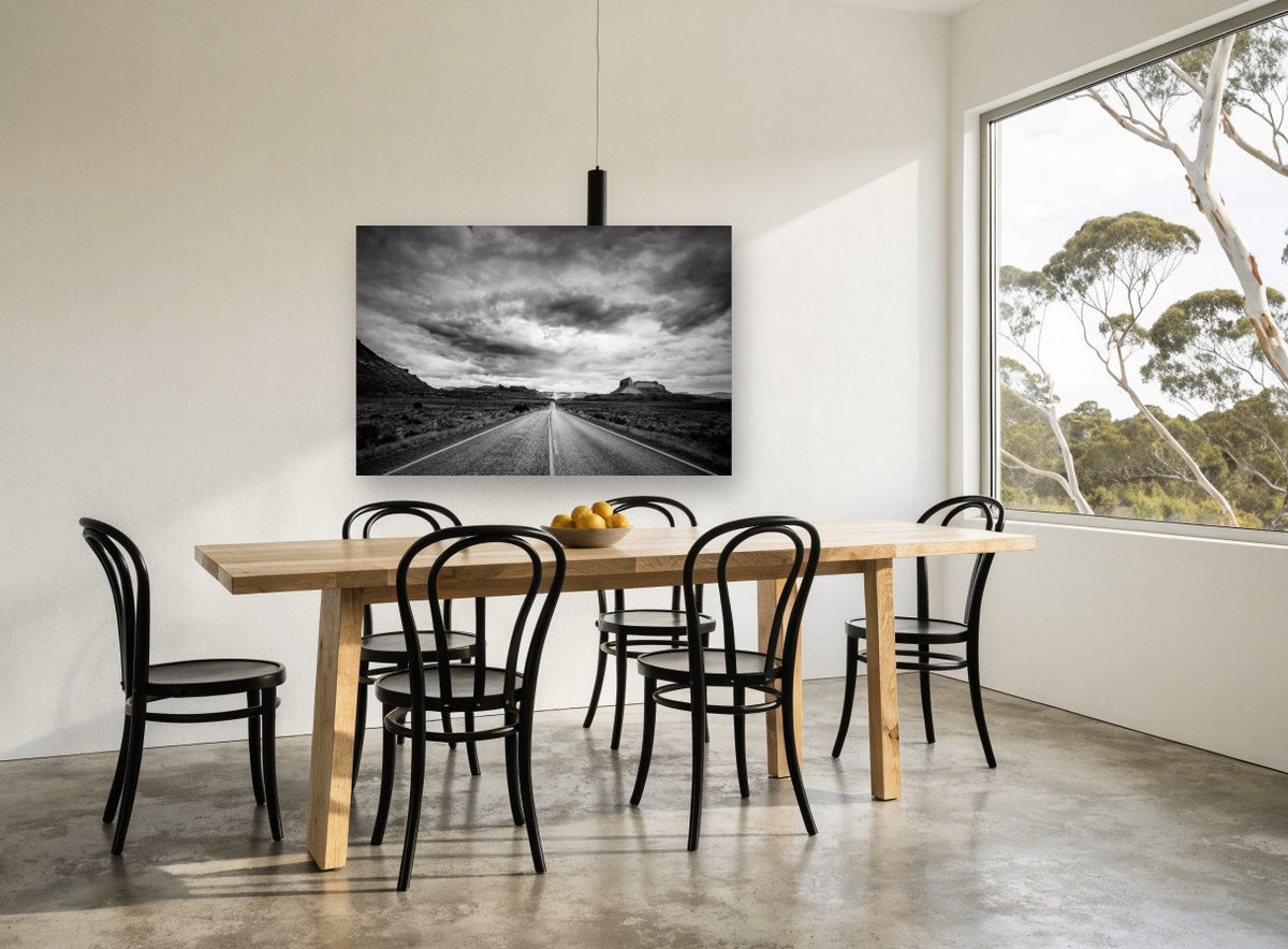 Desert Road Storm landscape canvas print on the wall of a dining room