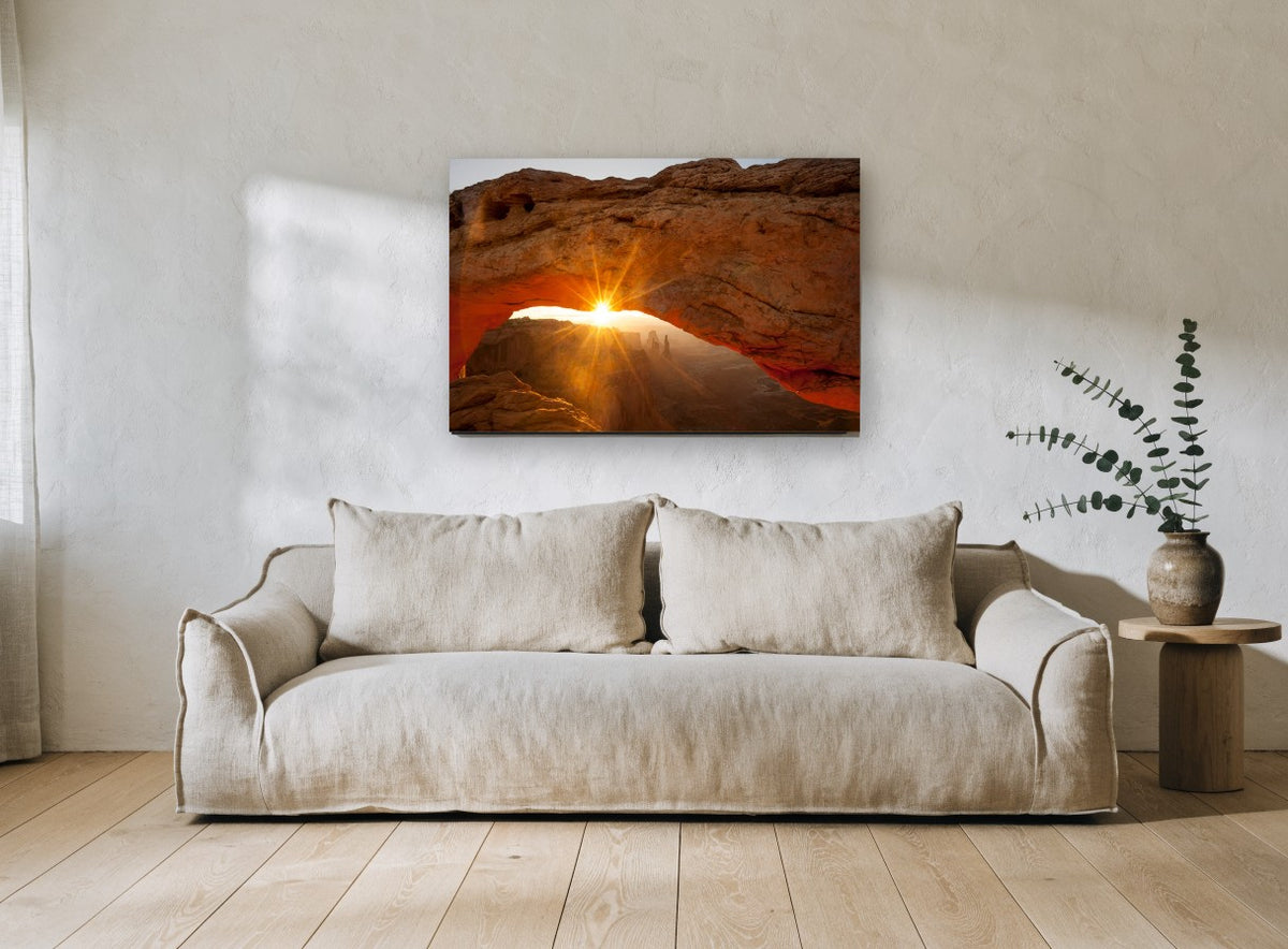 Sunburst Through Sandstone landscape canvas print on the wall of a living room