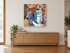 Daisies and Billiard Balls floral canvas print on the wall of a living room above a sideboard