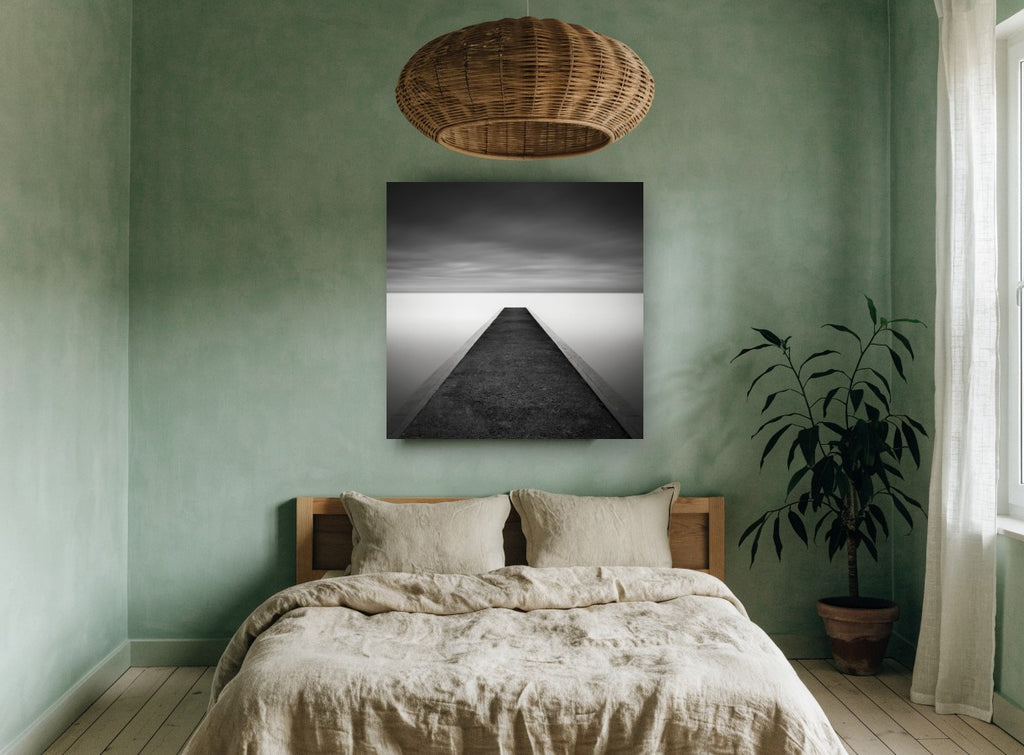 Concrete Jetty Stillness coastal canvas print on the wall of a bedroom