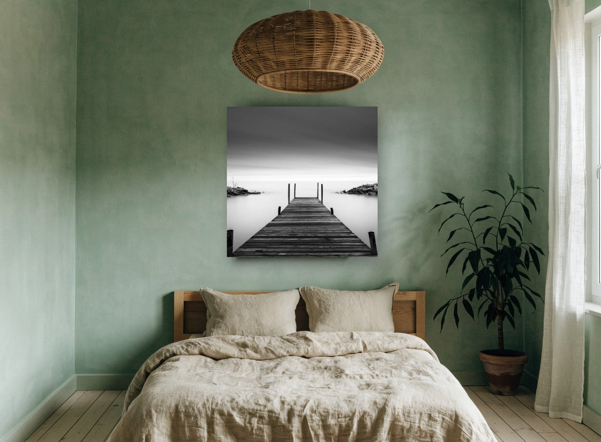 Still Water Jetty coastal canvas print on the wall of a bedroom