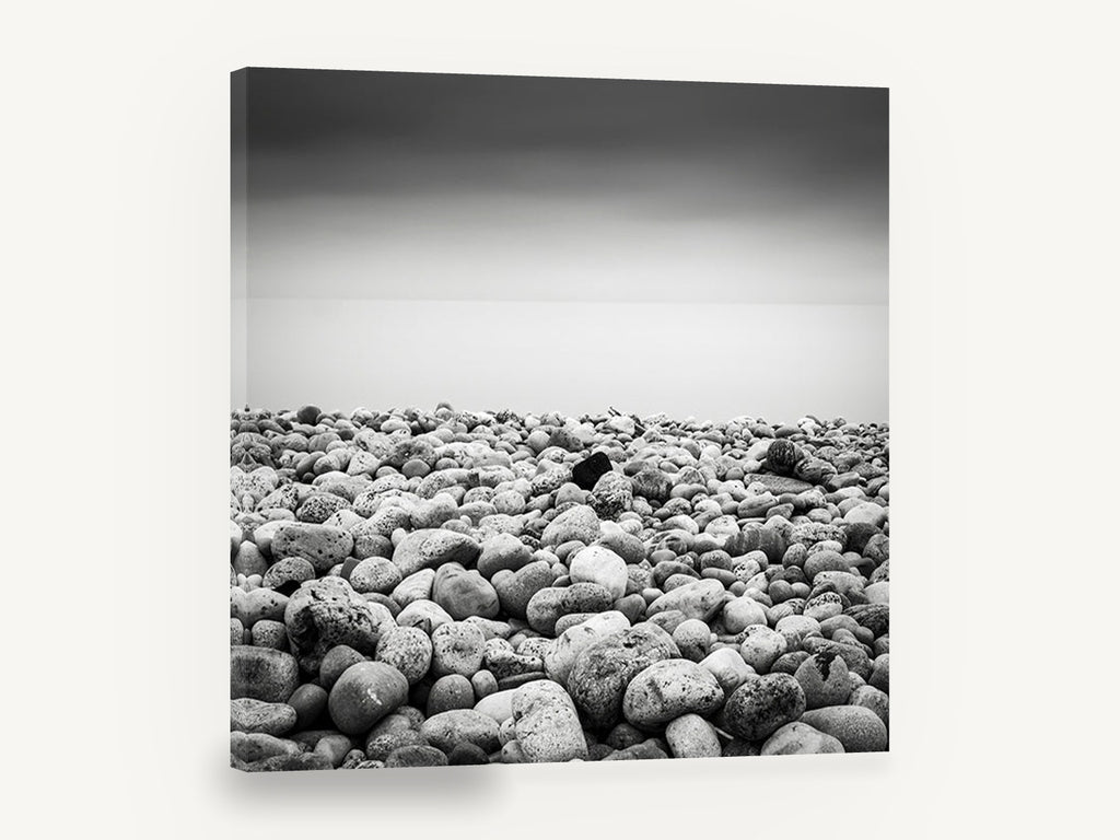 Pebble Shore Stillness, pebble beach black and white photograph, coastal canvas wall art print ready to hang