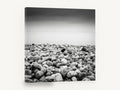 Pebble Shore Stillness, pebble beach black and white photograph, coastal canvas wall art print ready to hang